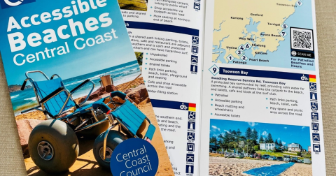 accesible beach brochure folder open with mpas, images, text and photos including matting and a beach wheelchair 