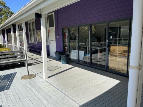 The Entrance Community Cafe front entrance purple door