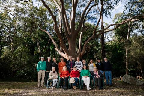 group of people in bush setting 